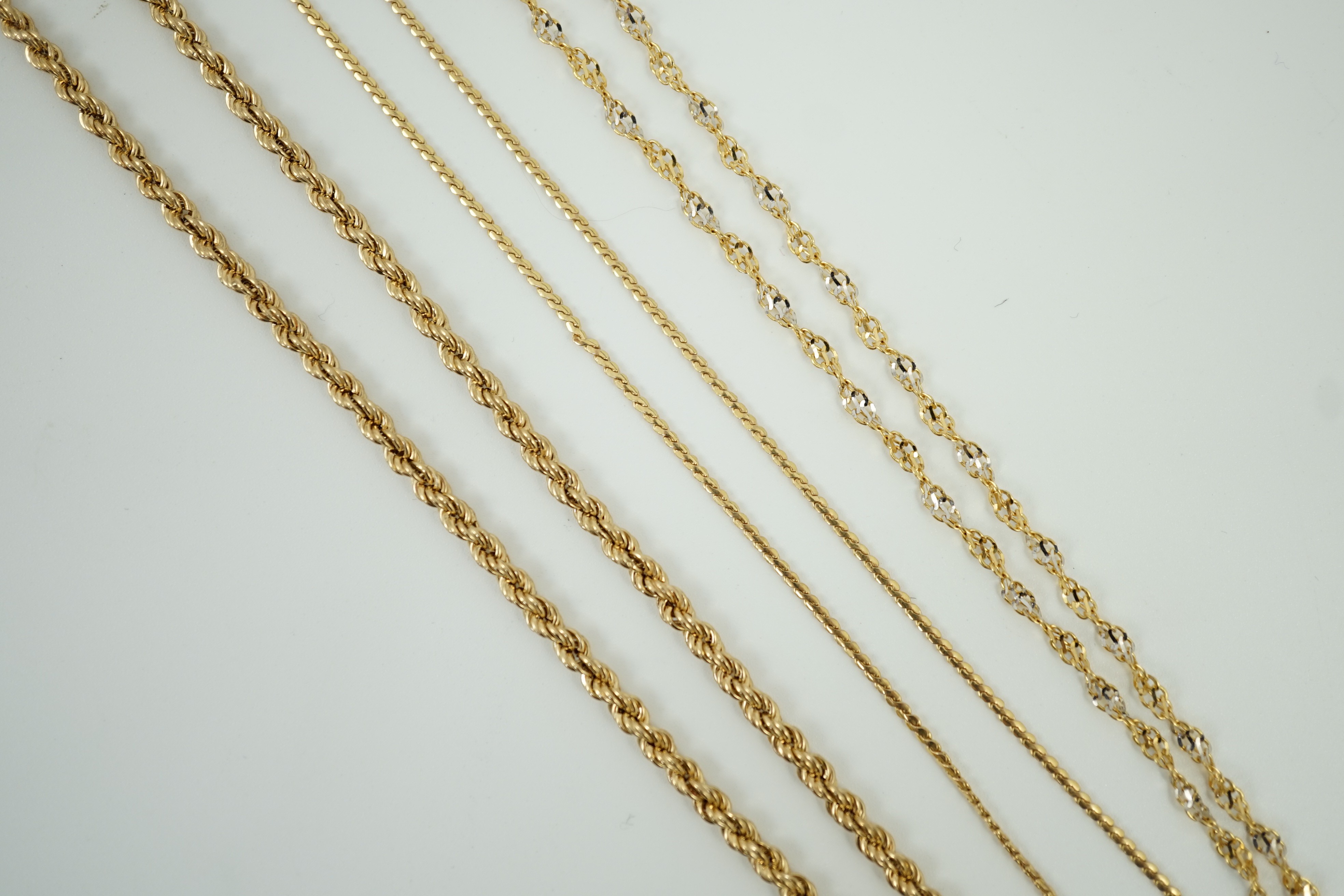 Four assorted modern 9ct gold chains, including rope twist, 39cm, 12.7 grams.